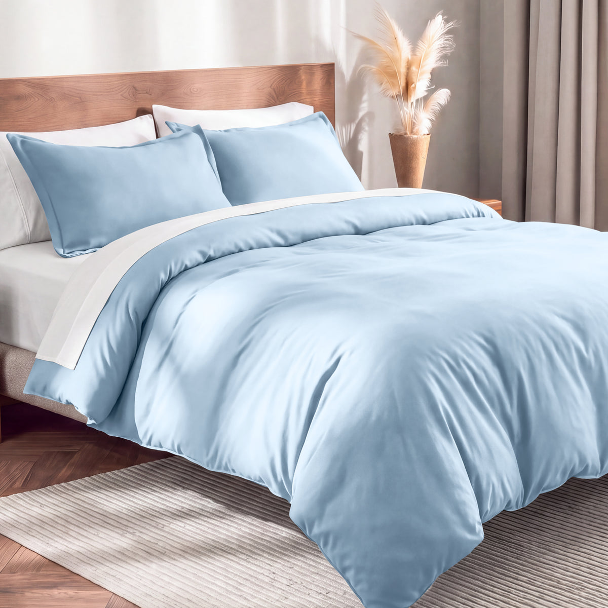 Flannel duvet cover set on a bed in a bedroom with a lamp and plant in the background.