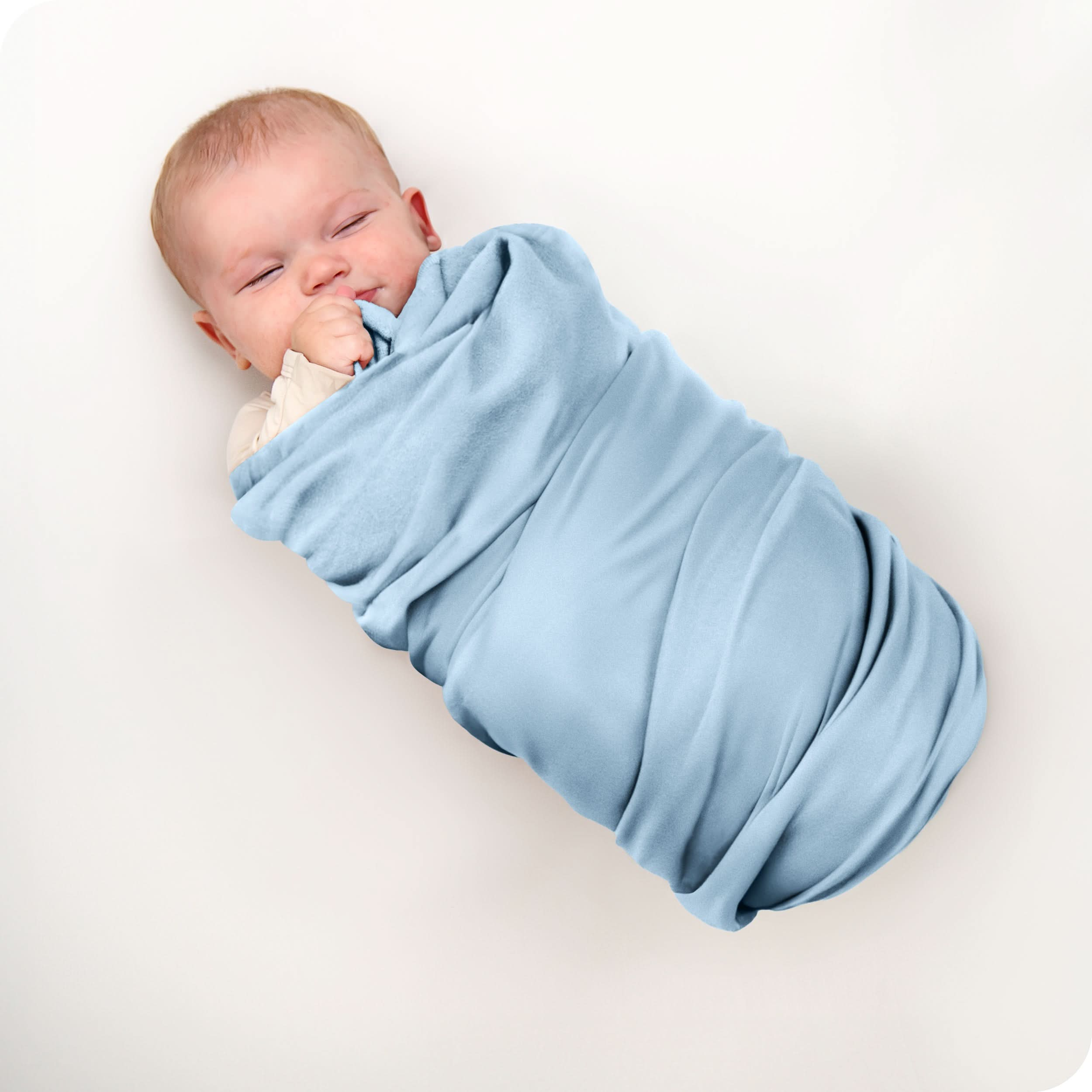 A baby swaddled in a receiving blanket