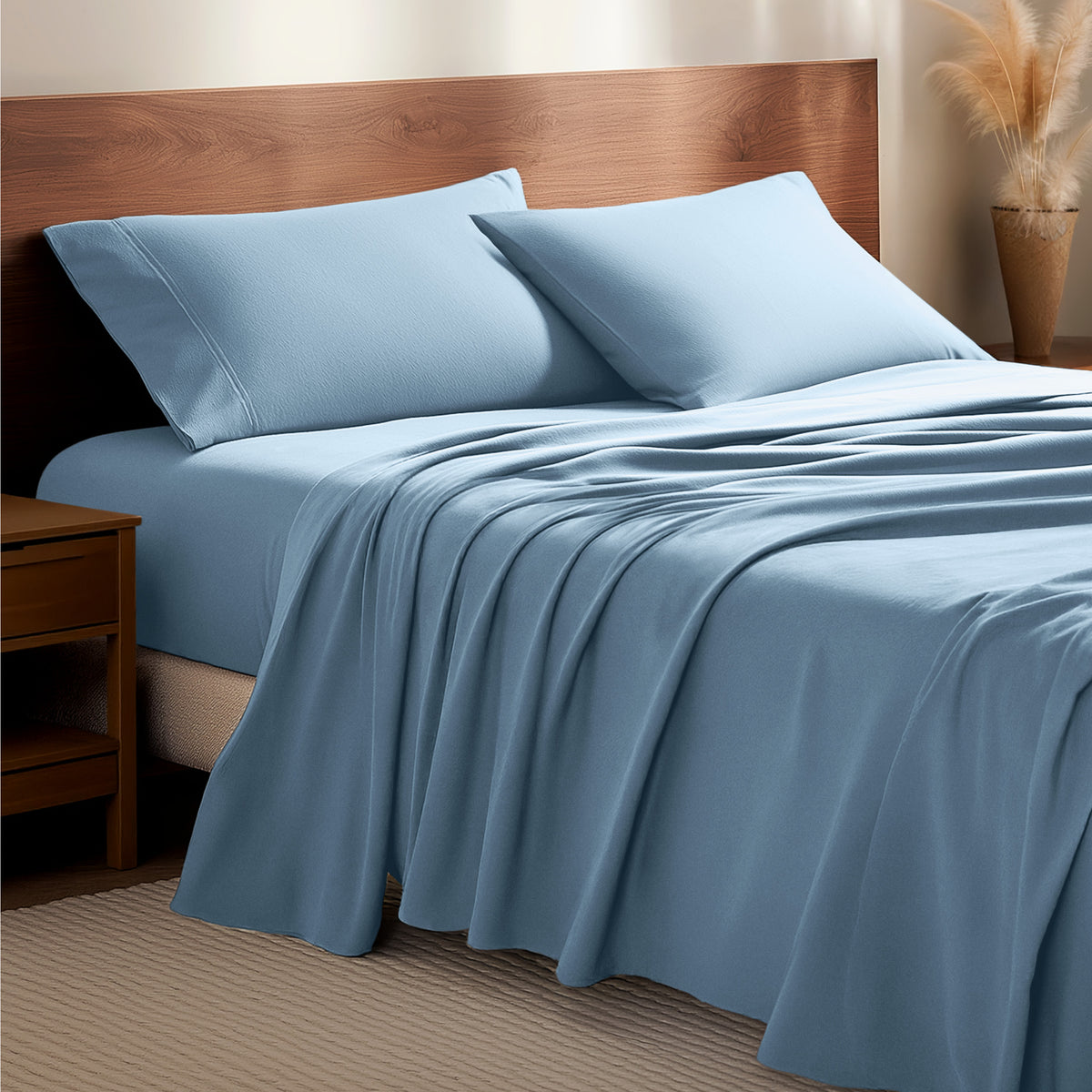 Flannel bedding set on a bed with a wooden headboard and side table