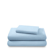 Cotton flannel sheet set folded and stacked on a white background
