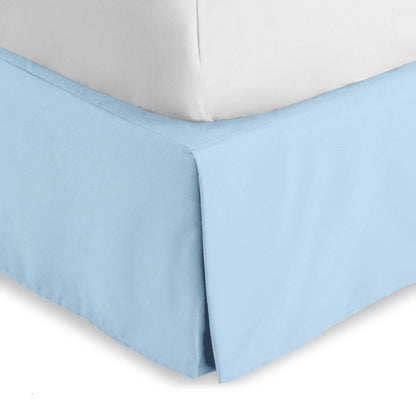Bed skirt on a bed with white bedding