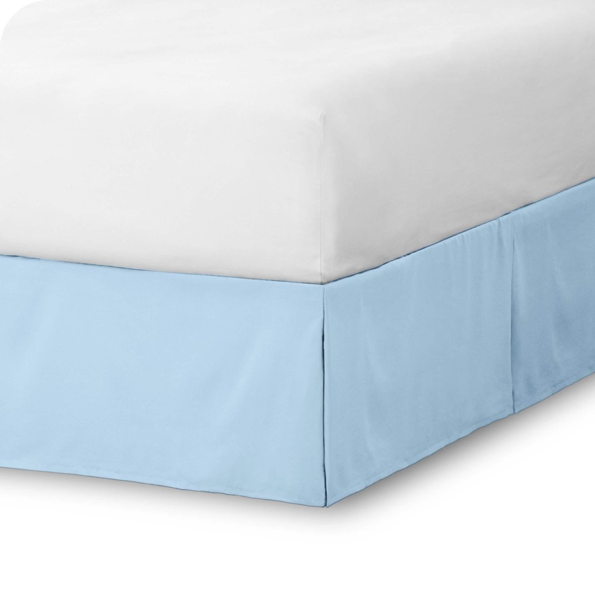 The corner of a bed skirt on a bed frame