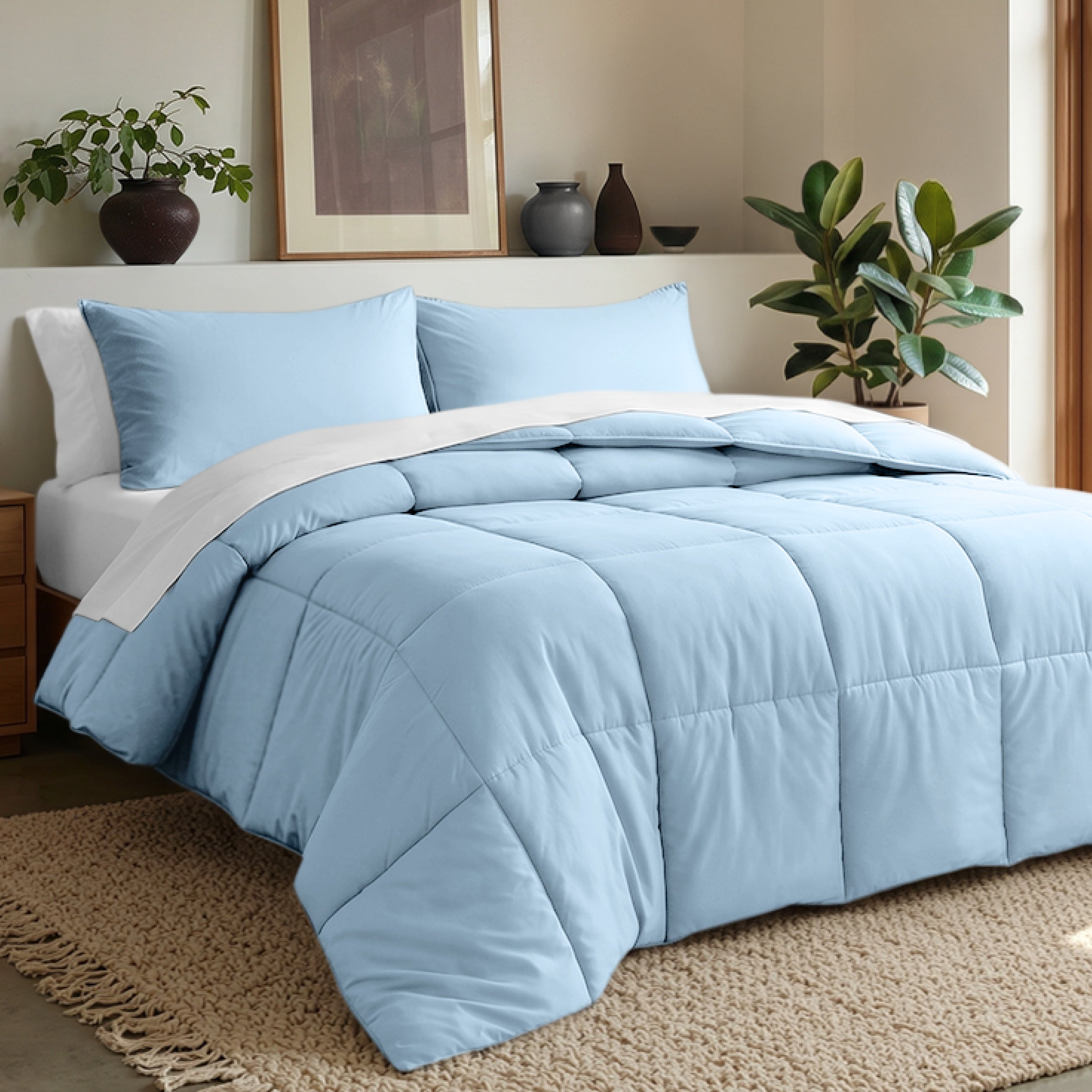 Comforter set on a bed in a bedroom with plants and decor.