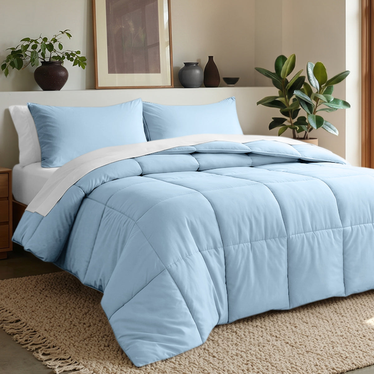 Comforter set on a bed in a bedroom with plants and decor.