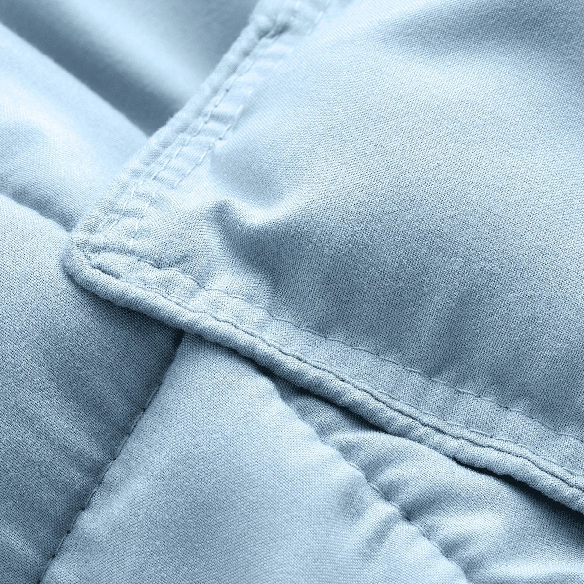 Close-up of comforter fabric with stitching detail