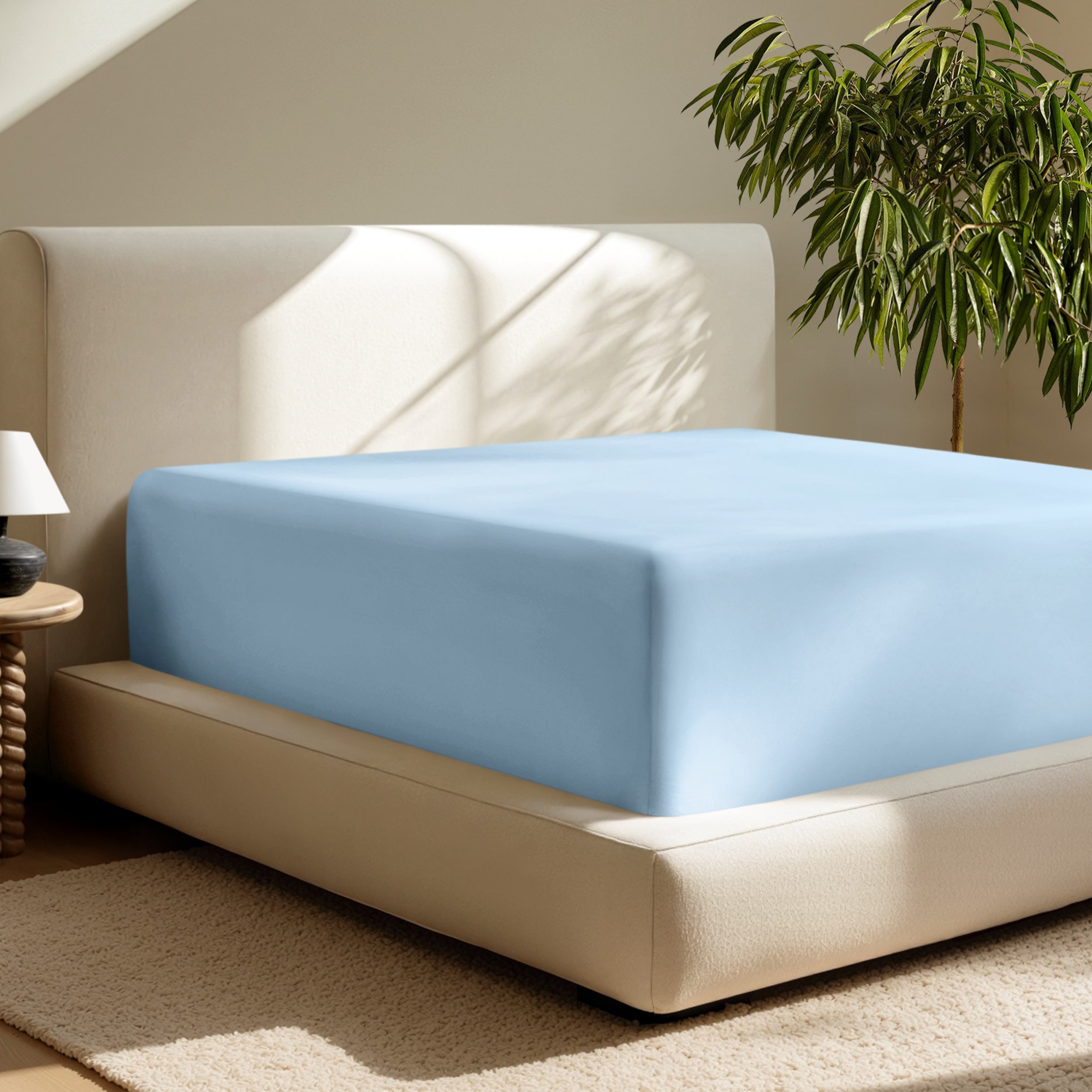 A deep pocket fitted sheet on a mattress