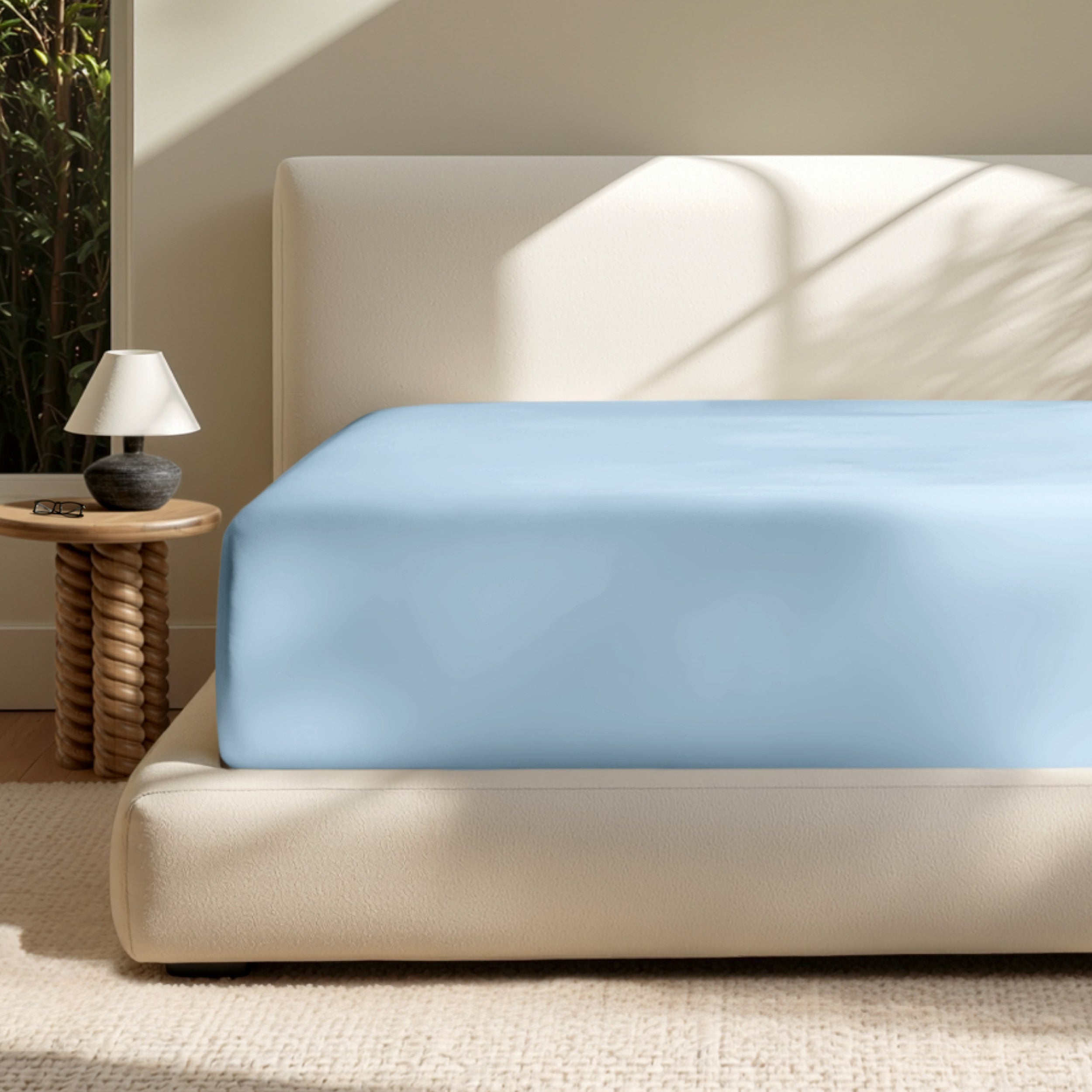 A deep pocket mattress with a fitted sheet on it