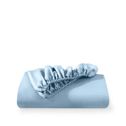 A fitted sheet folded neatly with the all around elastic showing