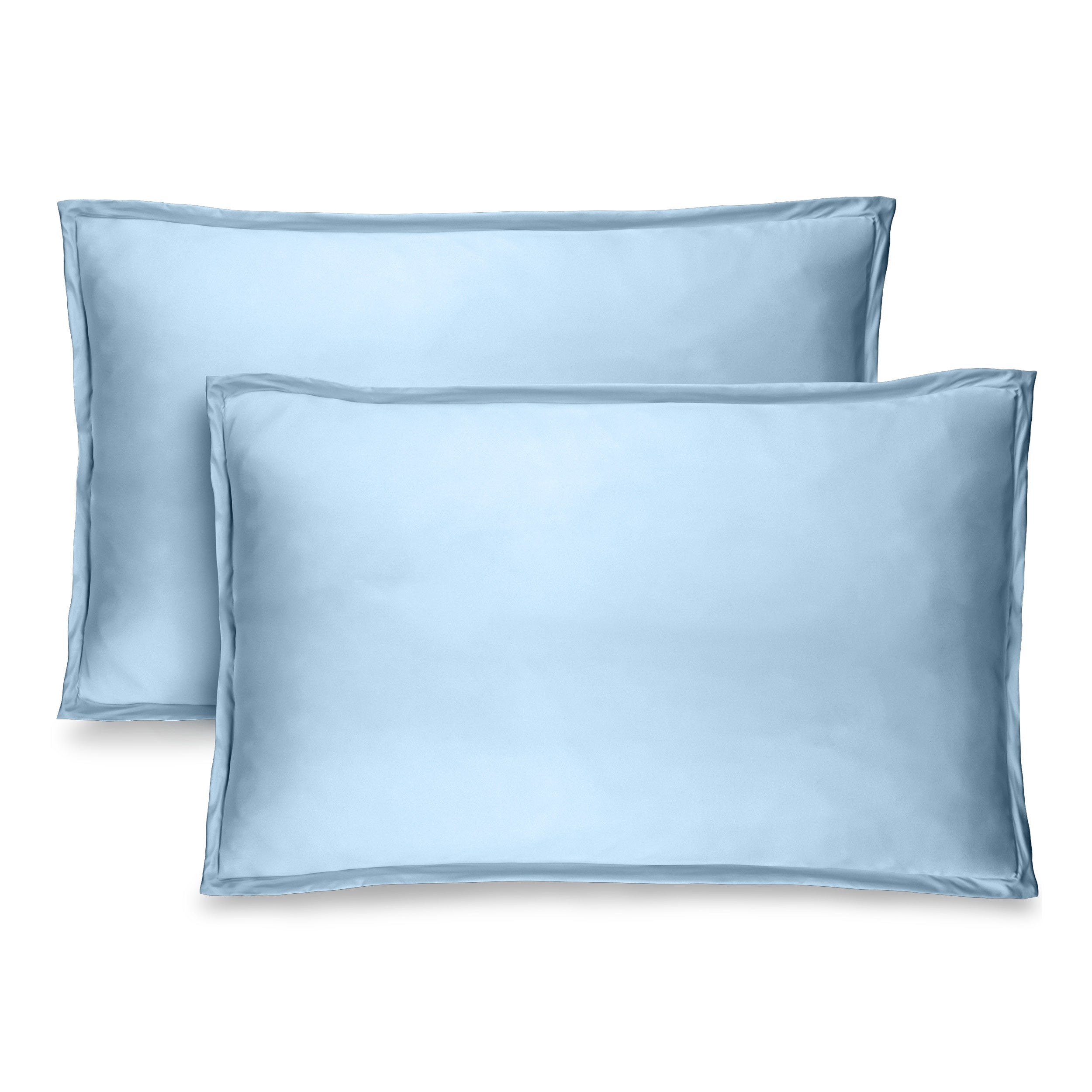 Two light blue pillow shams on pillows standing up with one behind the other