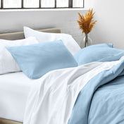 Close up of pillow shams on a bed
