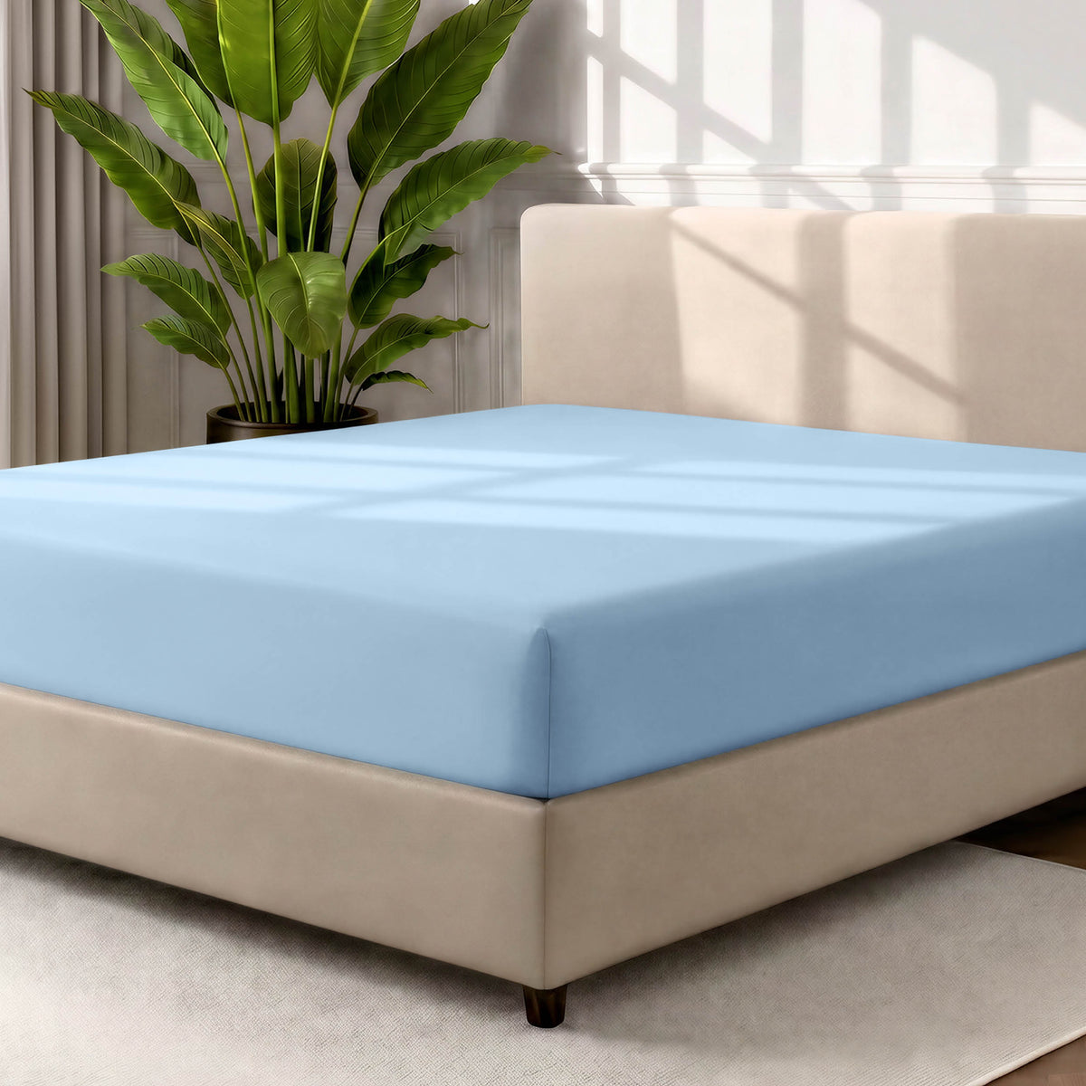 Ultra soft fitted sheet on a mattress with the sun shining into the bedroom
