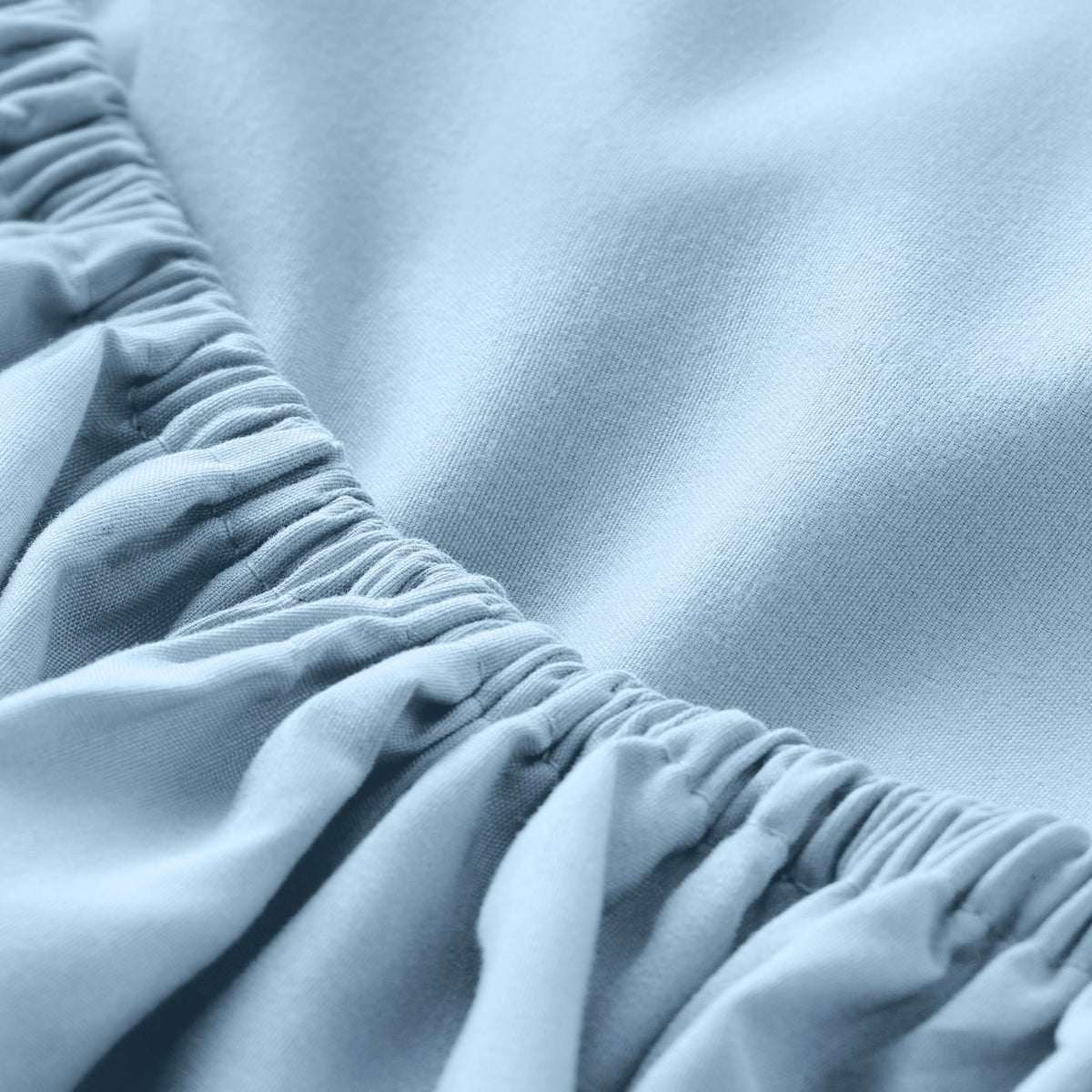 Close-up of fitted sheet with all around elastic