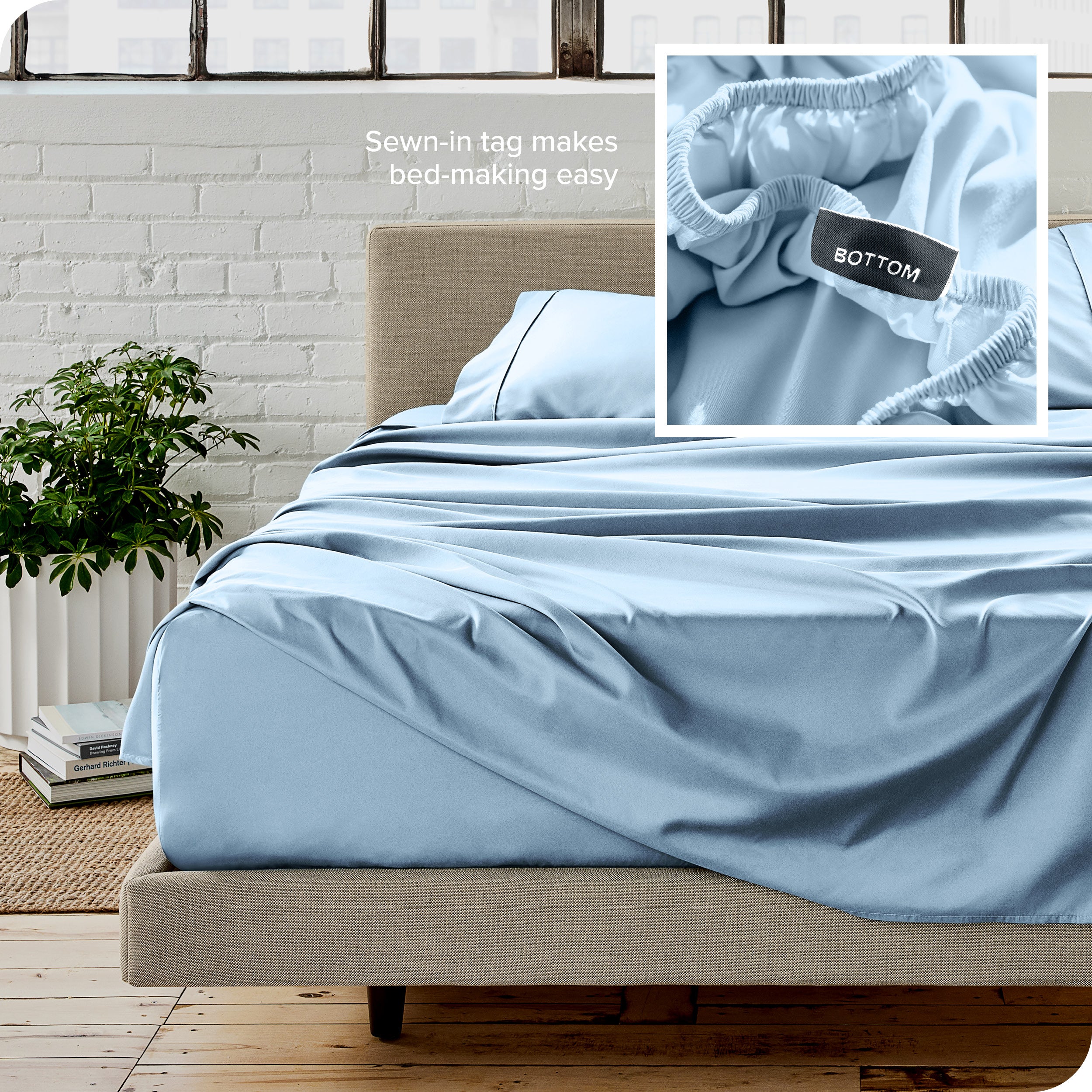 Close up of sewn in tag and matching sheets on a bed