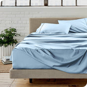 A modern bedroom with microfiber sheets on the mattress