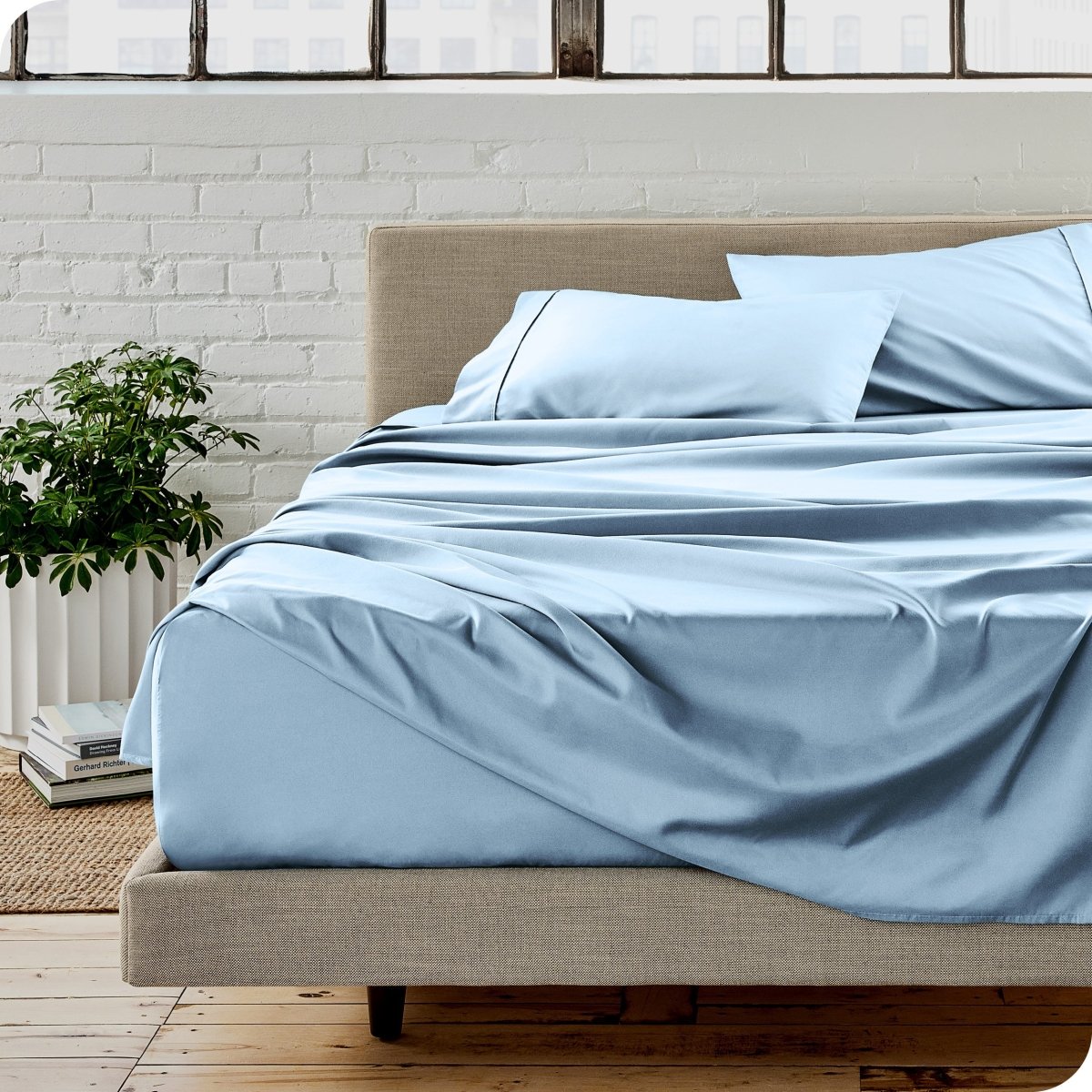 A modern bedroom with microfiber sheets on the mattress