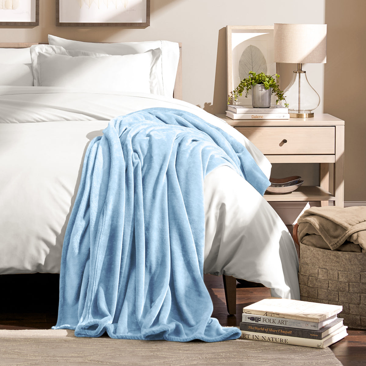Microplush blanket draped over the corner of a bed