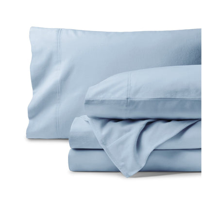 Organic flannel bed sheets and pillowcase set on a white background