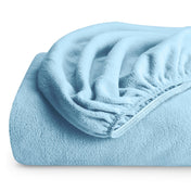 A polar fleece fitted sheet folded
