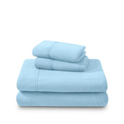 Polar fleece sheets and pillowcases folded and stacked on a white background