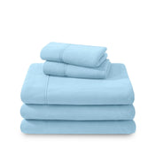 Polar fleece sheets and pillowcases folded and stacked on a white background
