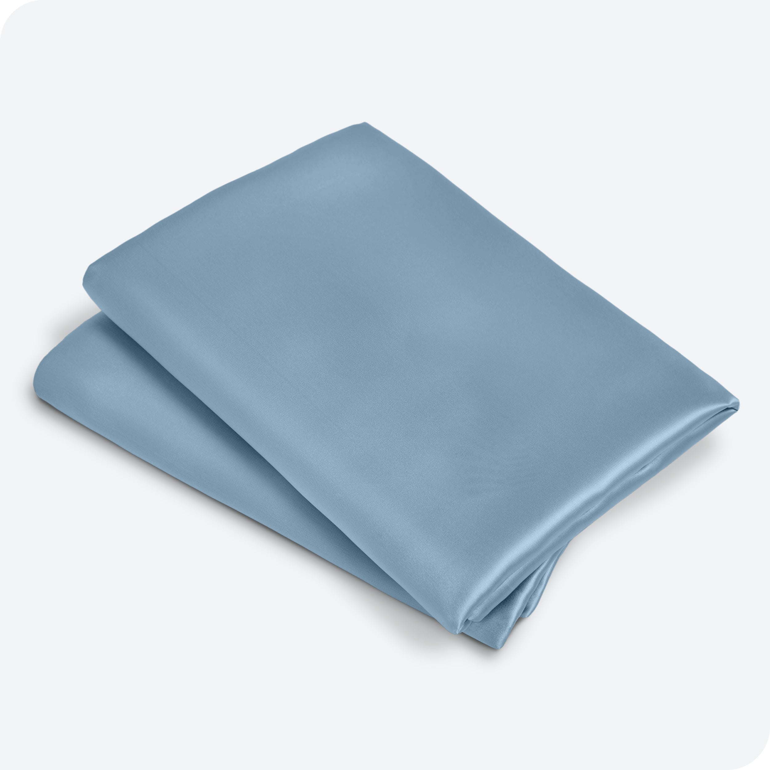 Two satin pillowcases folded and stacked