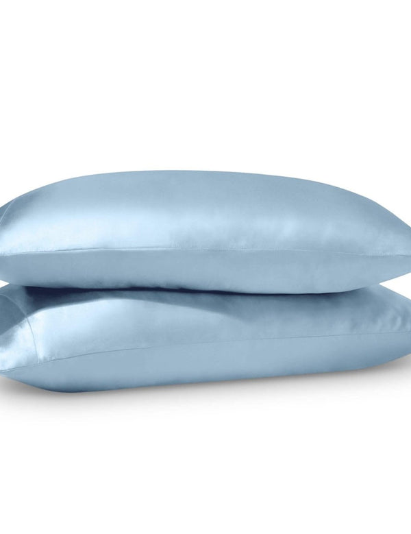 2 satin pillowcases on pillows stacked