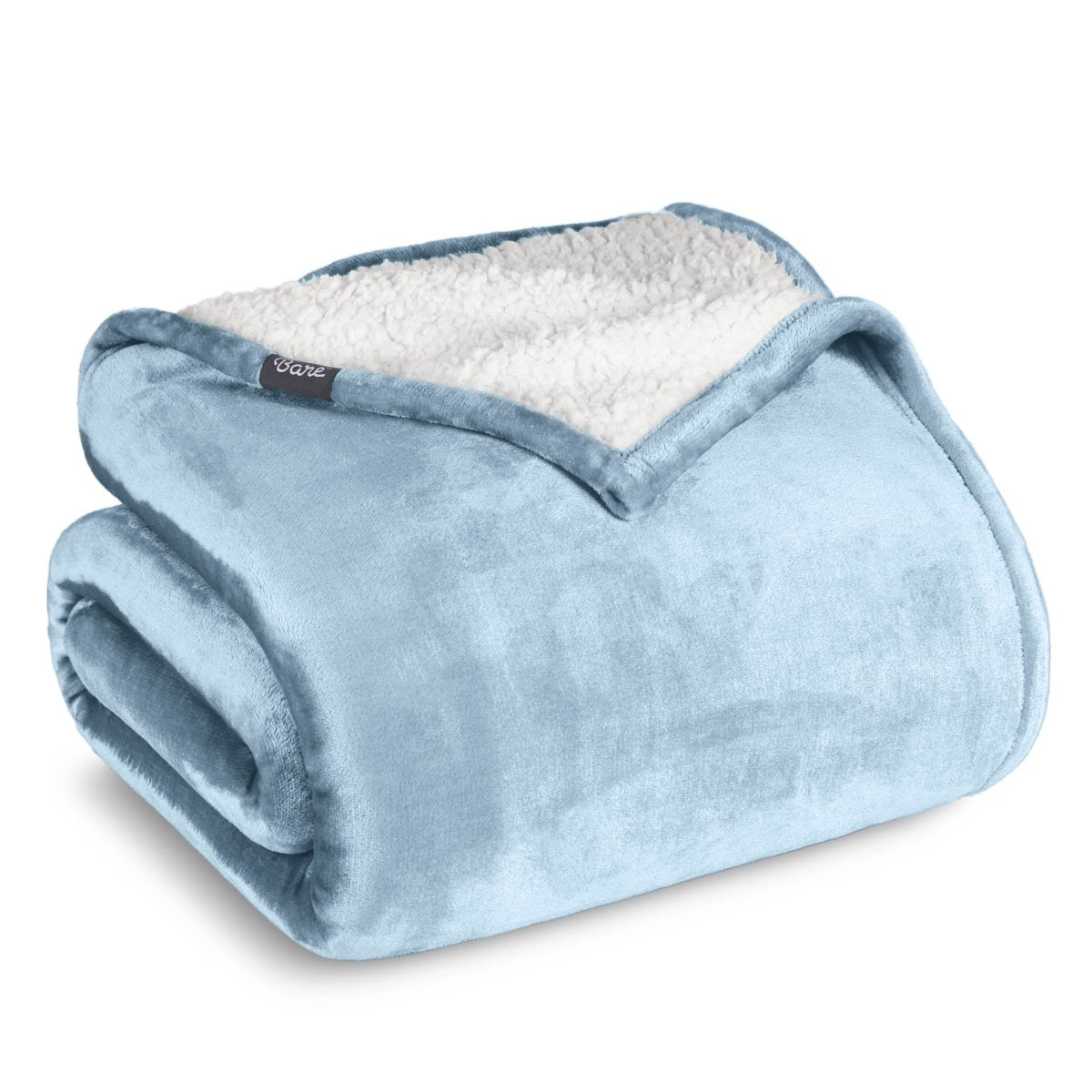 A sherpa blanket folded neatly while showing both sides