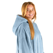 An adult with a sherpa wearable blanket on