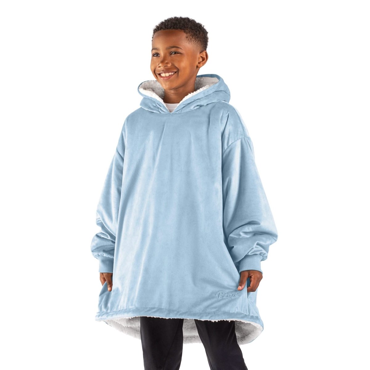 A child with a sherpa wearable blanket on
