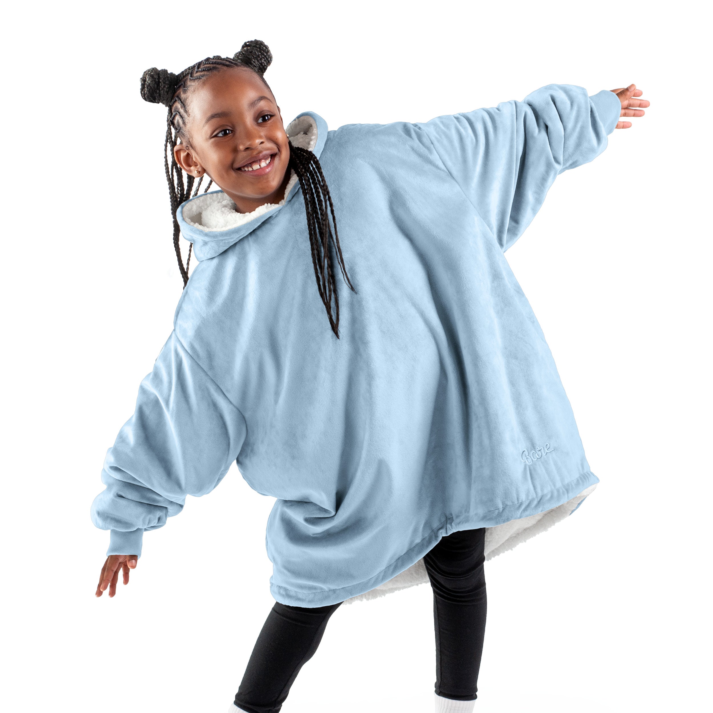 A child with a wearable blanket on