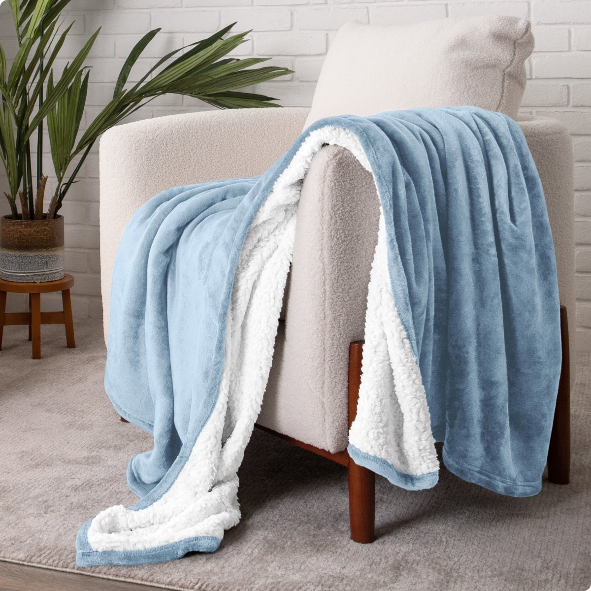 Blanket draped over a chair in a cozy living room setting.