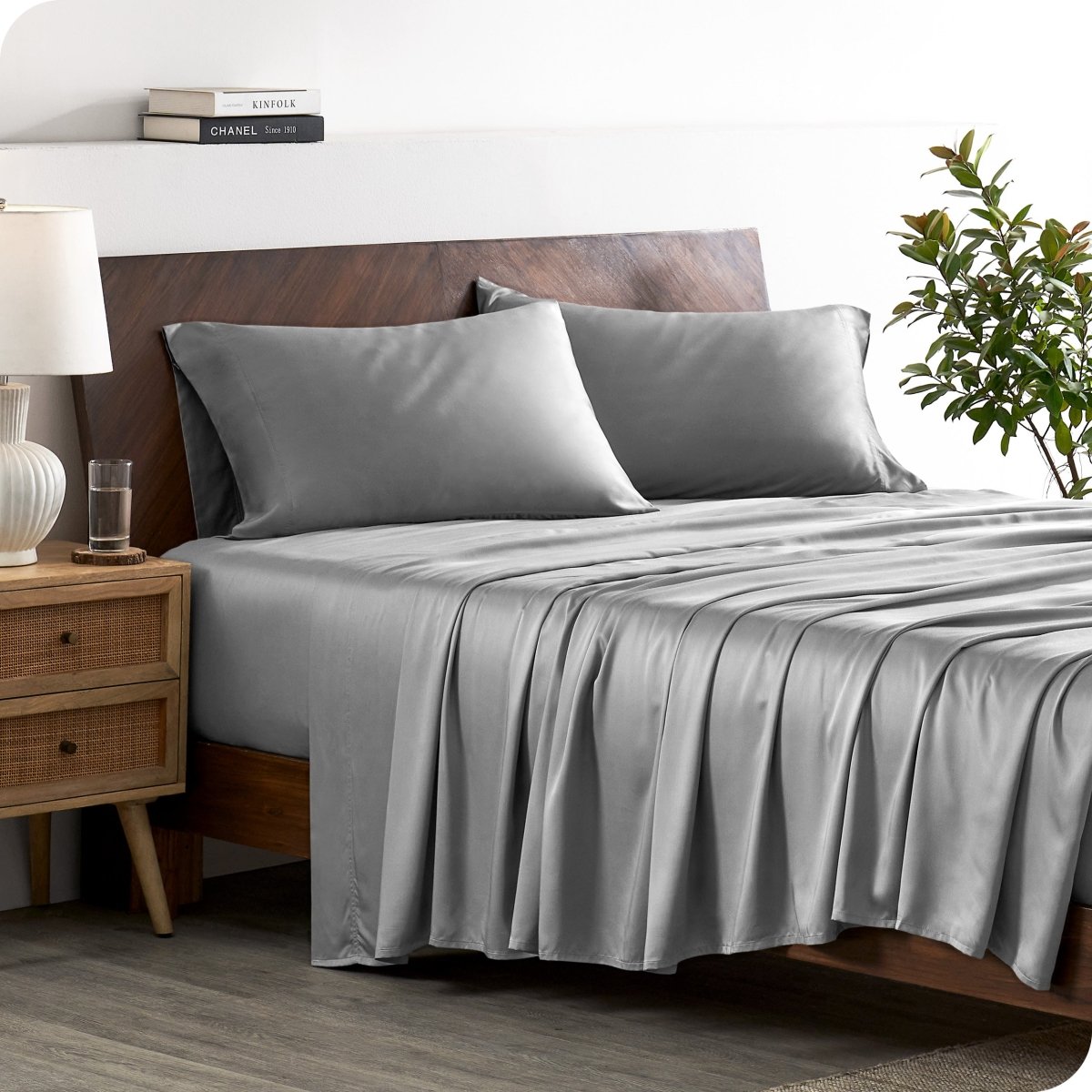 A stylish bed with bamboo sheets and pillowcases, showcasing a sophisticated and elegant bedroom setting.