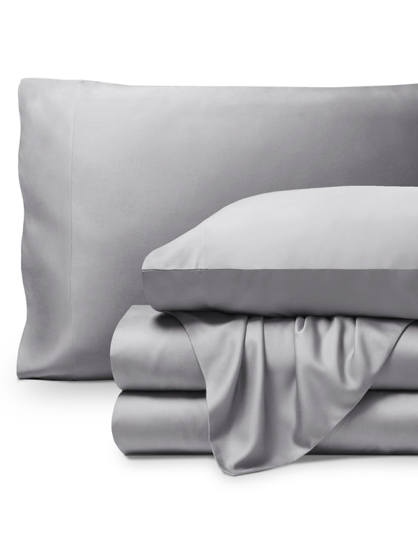 Bamboo pillowcases and sheets set on a white background