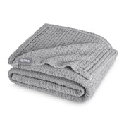 A cotton waffle blanket folded