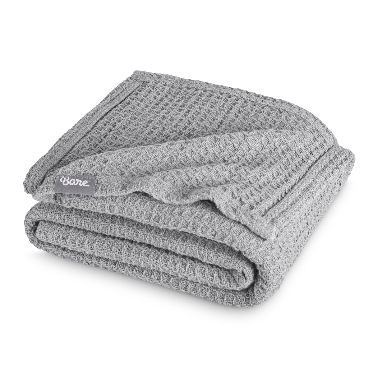Folded blanket with a Bare Home label on a white background