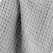 Close up of the fabric of a cotton waffle blanket