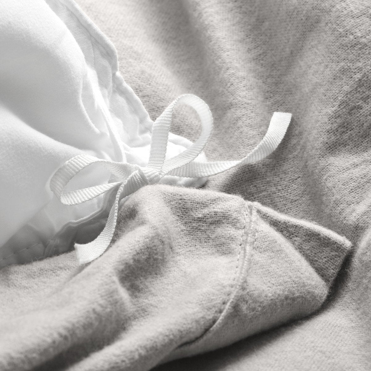 Close-up of the ties on a flannel duvet cover