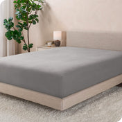 A modern bed with a flannel fitted sheet on