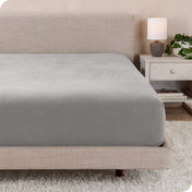 A close up of a modern bed with a flannel fitted sheet on