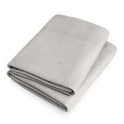 Folded flannel pillowcase set on a white background