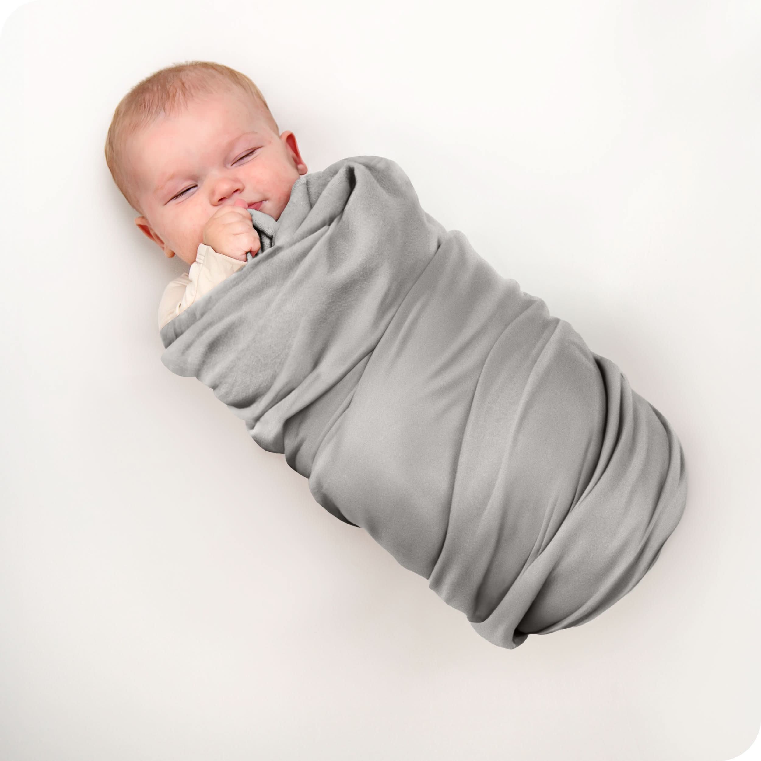 A baby swaddled in a receiving blanket