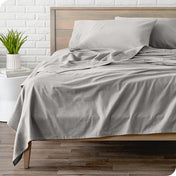 A modern bed with a flannel sheet set on