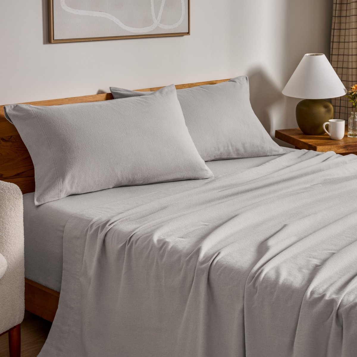 Flannel bed sheets and pillowcases on a bed in a bedroom setting.