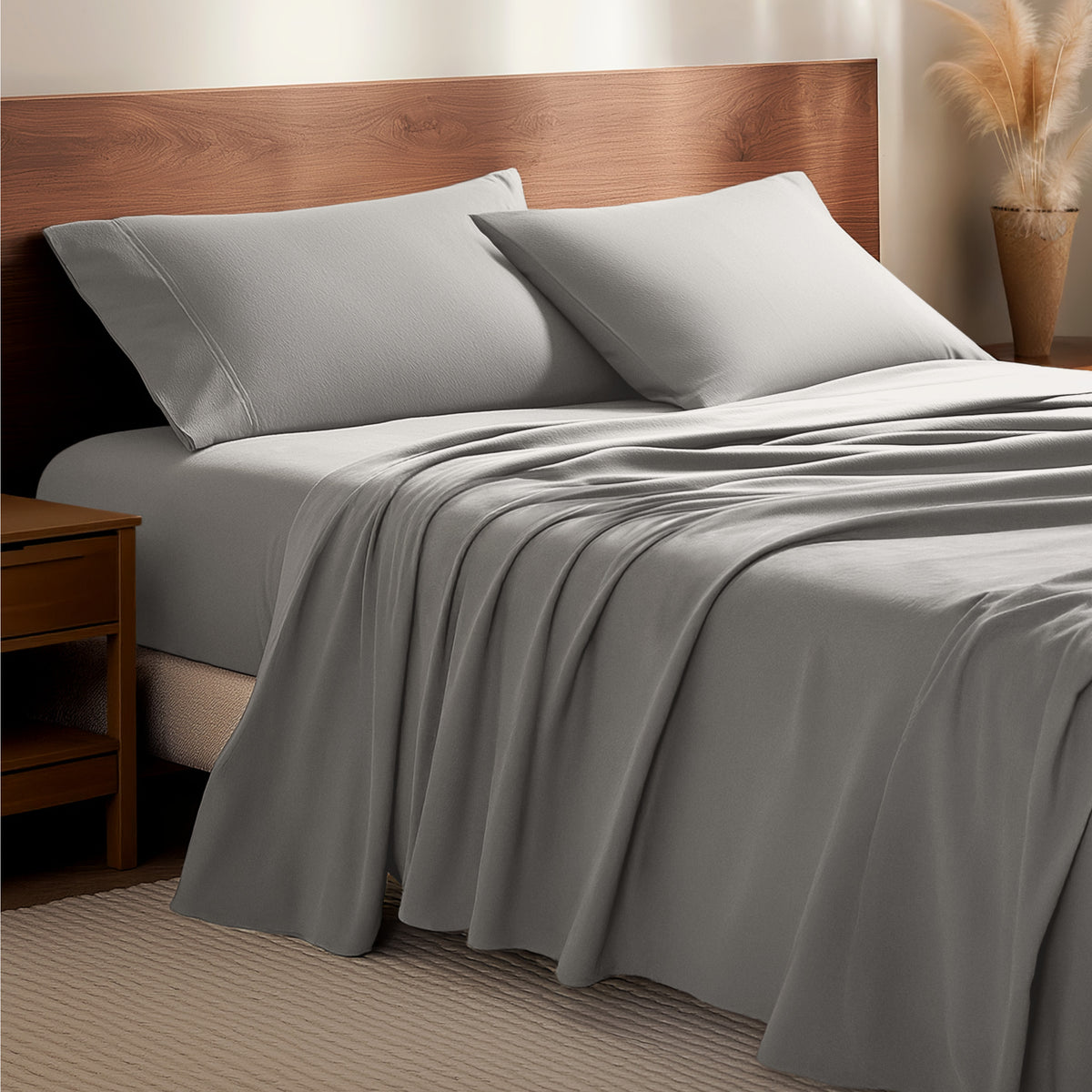 Flannel bedding set on a bed with a wooden headboard and side table