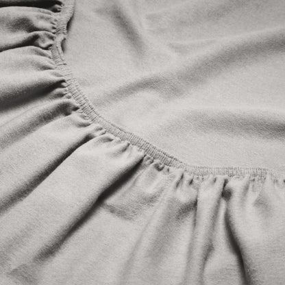 Close-up of a flannel fitted sheet with gathered elastic