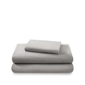 Cotton flannel sheet set folded and stacked on a white background