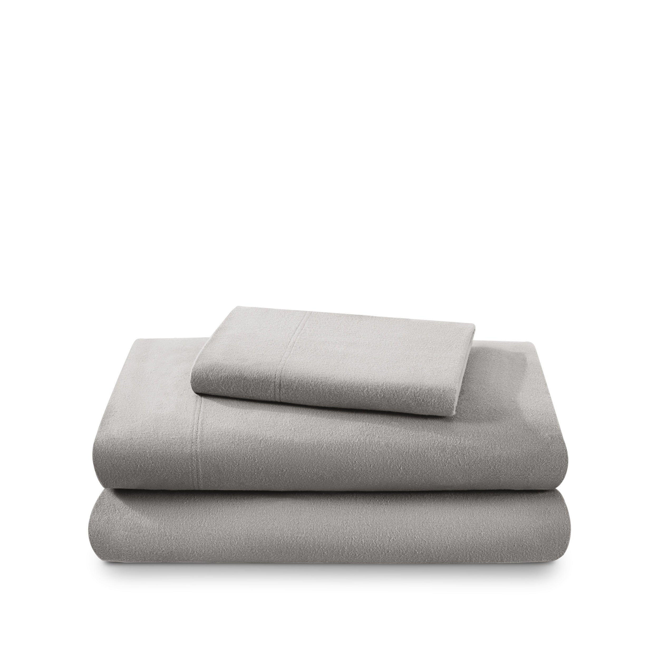 Cotton flannel sheet set folded and stacked on a white background