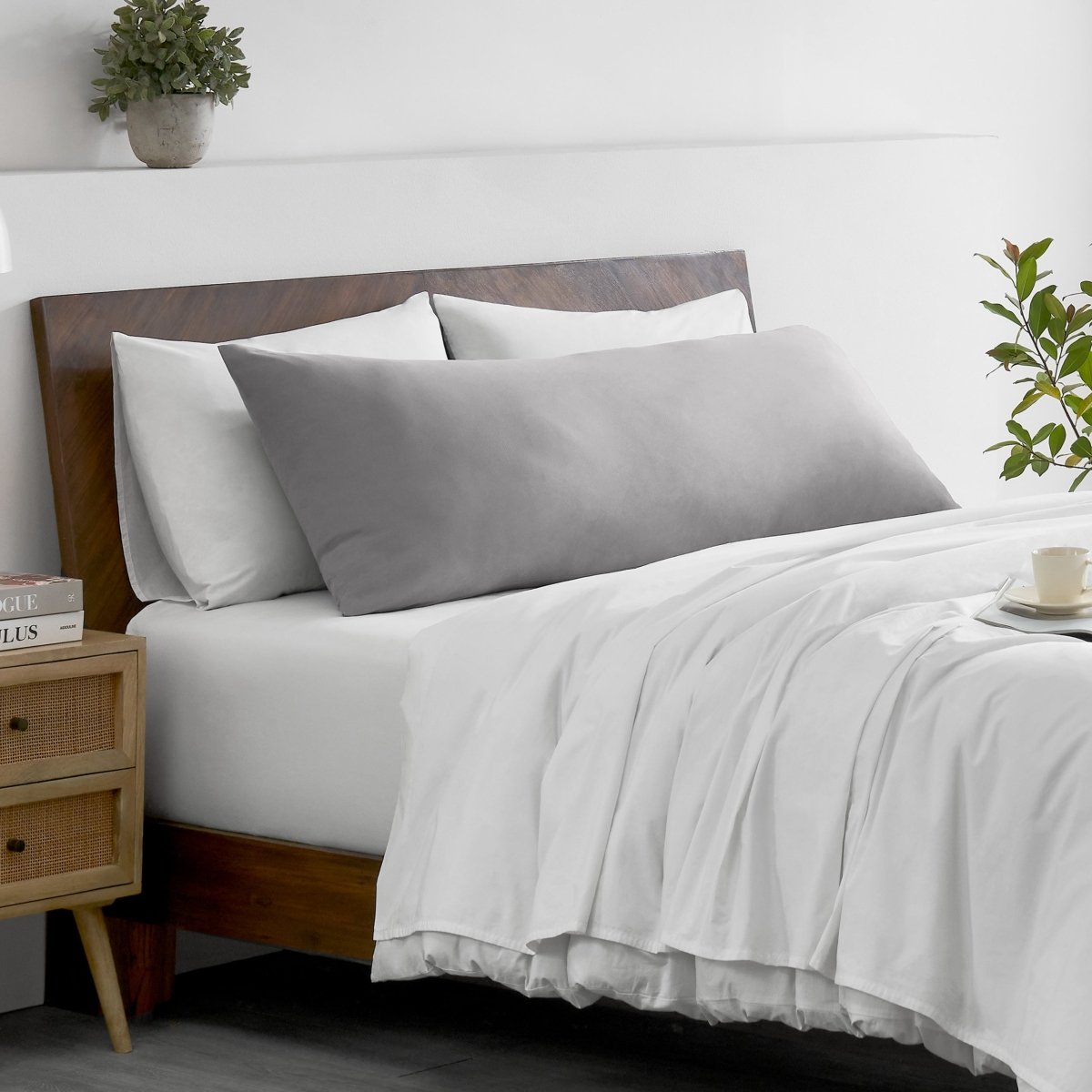 Bed with microfiber bedding and wooden headboard in a bedroom setting