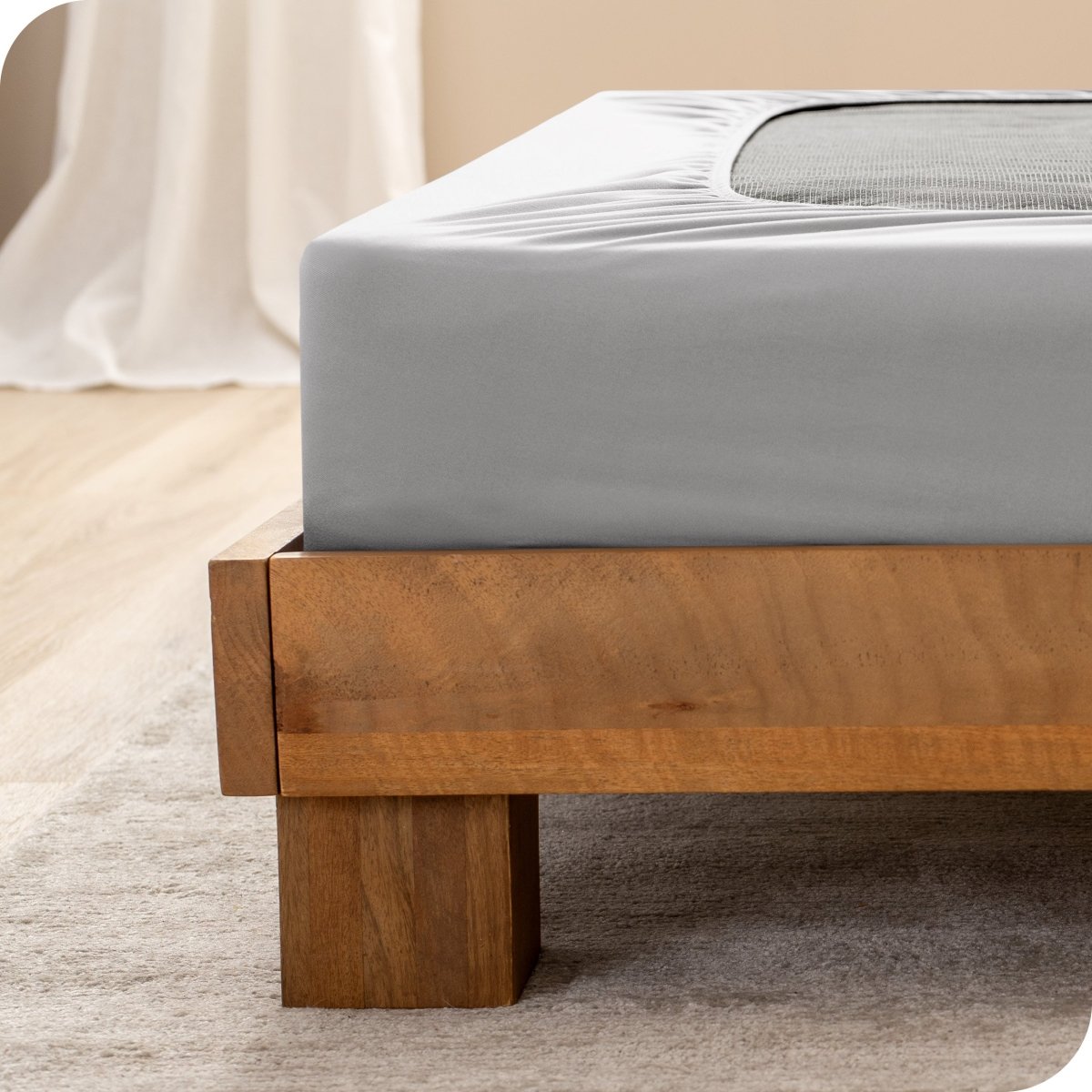 Close up of the corner of a bed frame with a cover box spring 