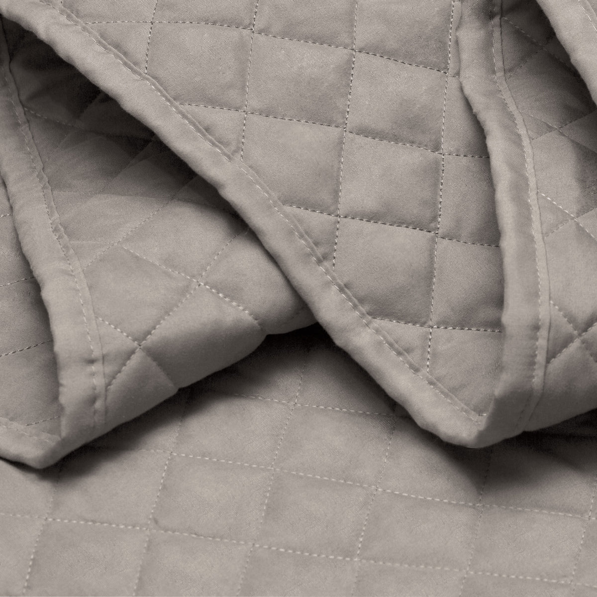 Close in view showing texture of coverlet set fabric